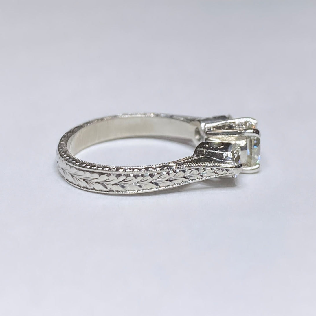 1 1/10ctw Round Three Stone Platinum Ring