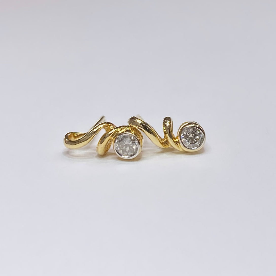 14k 1/6tcw Diamond Swirl Earrings