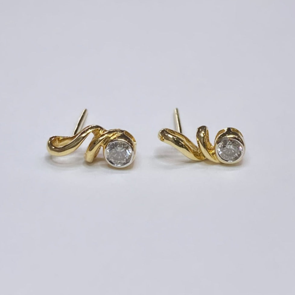 14k 1/6tcw Diamond Swirl Earrings