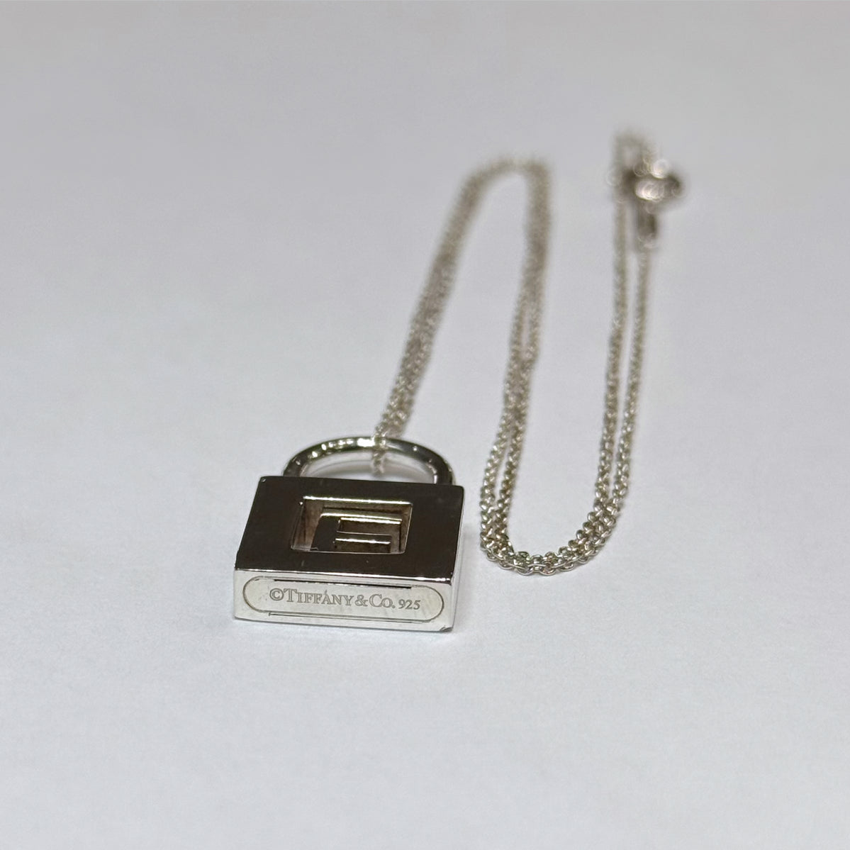 T & Co. 925 Initial "E" Lock Necklace