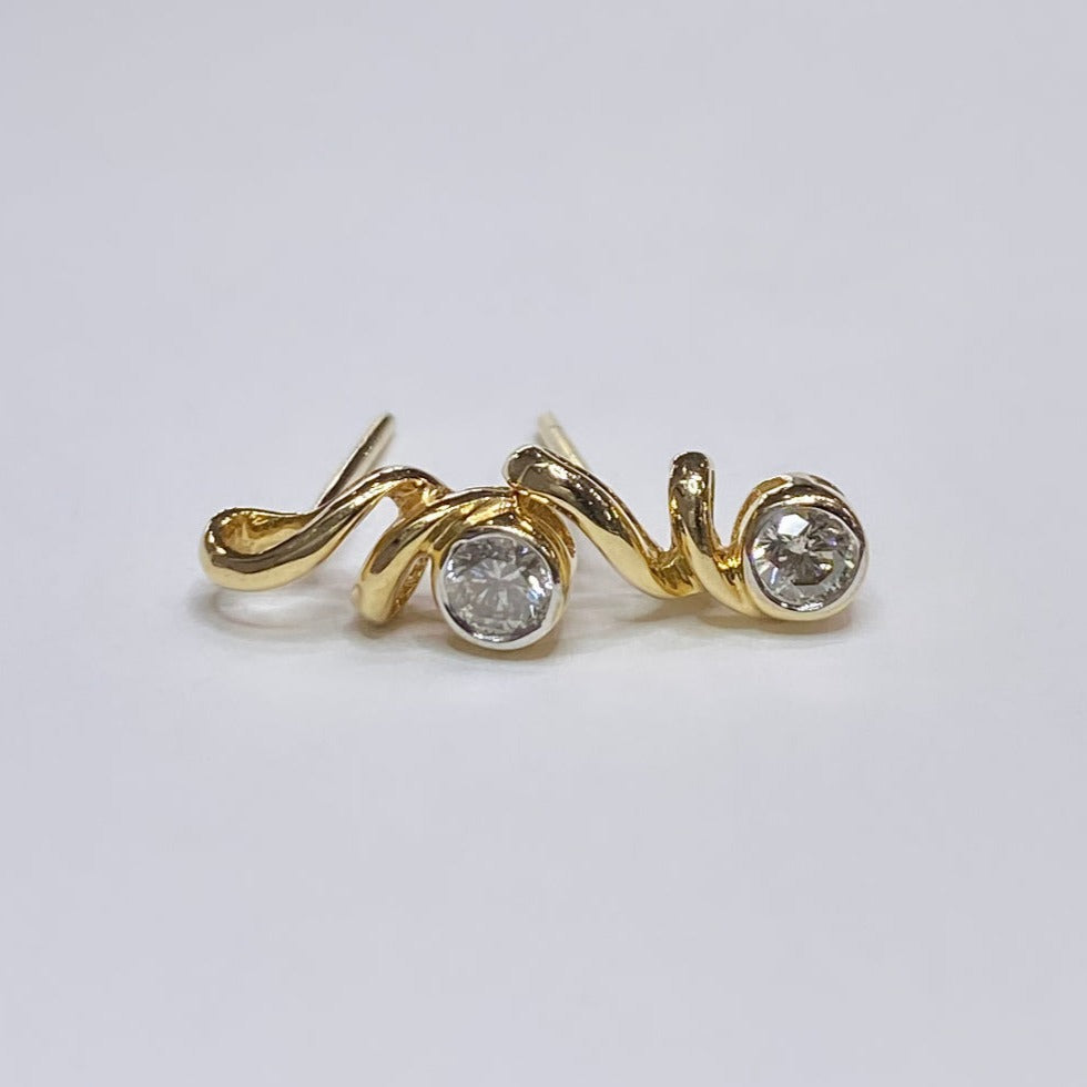 14k 1/6tcw Diamond Swirl Earrings