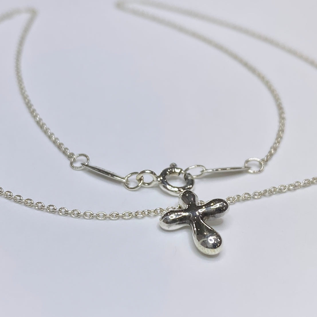 Tiffany small silver cross on sale necklace